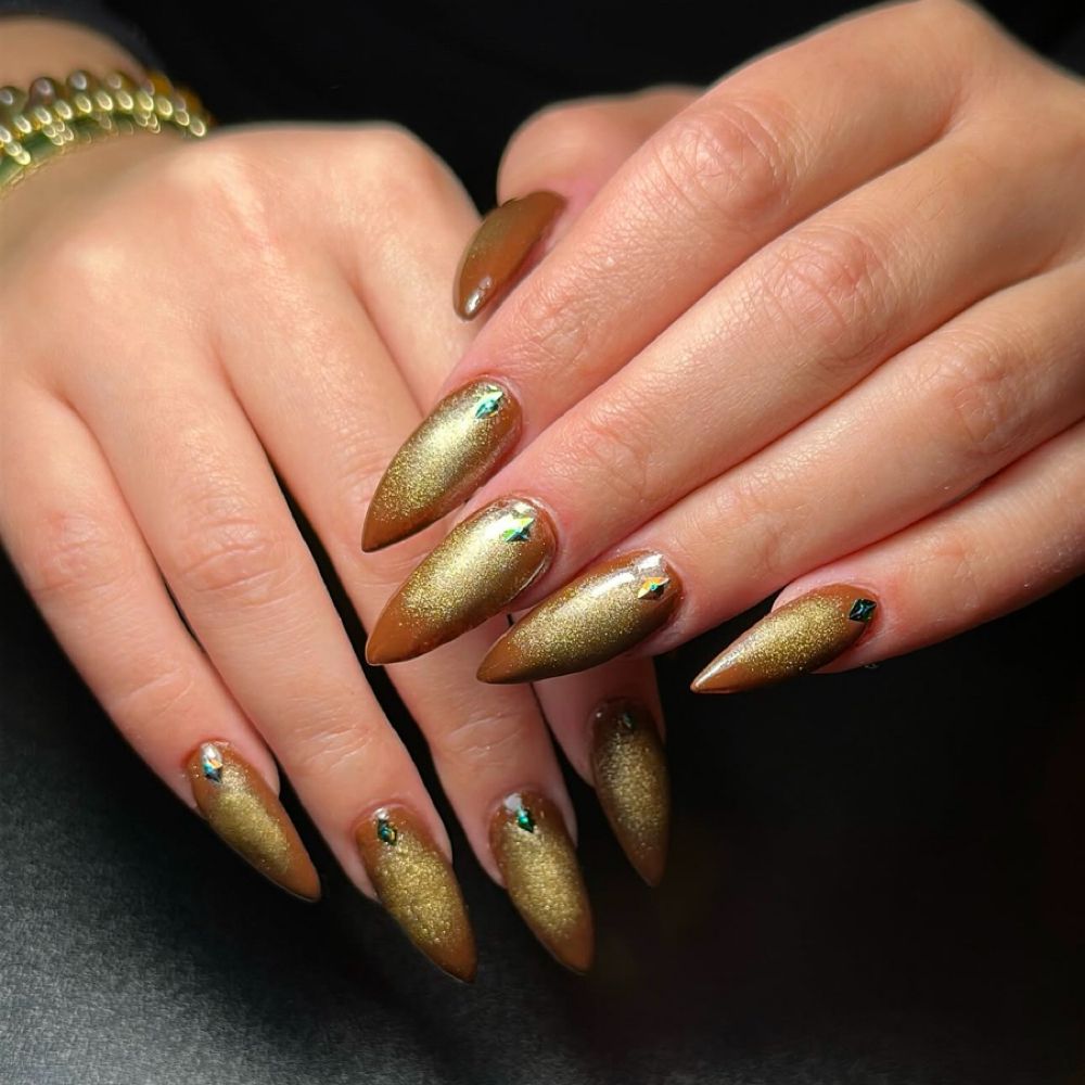 Gold chrome almond nails